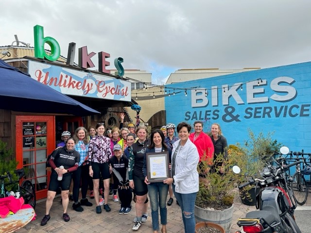 Assemblywoman Cottie Petrie-Norris with owners Lisa & Stephanie Fleischaker and group of cyclists.