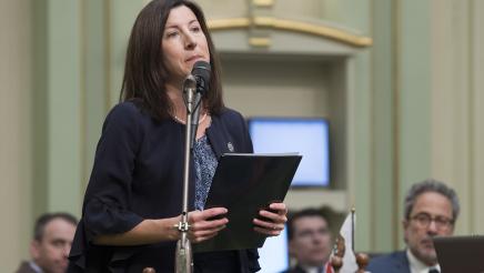 Assemblymember Cottie Petrie-Norris reads during the  Women's History Month Resolution