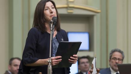 Assemblymember Cottie Petrie-Norris reads during the  Women's History Month Resolution