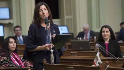 Assemblymember Cottie Petrie-Norris reads during the  Women's History Month Resolution